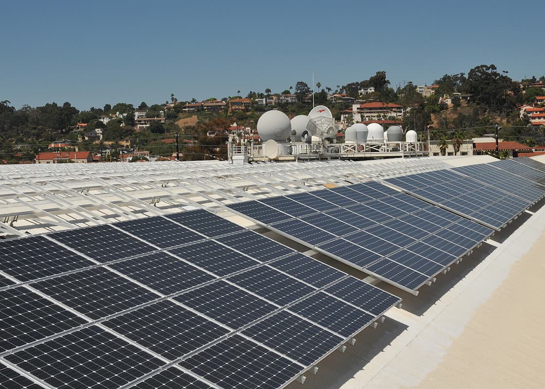 Rows of solar panels on a flat rooftop