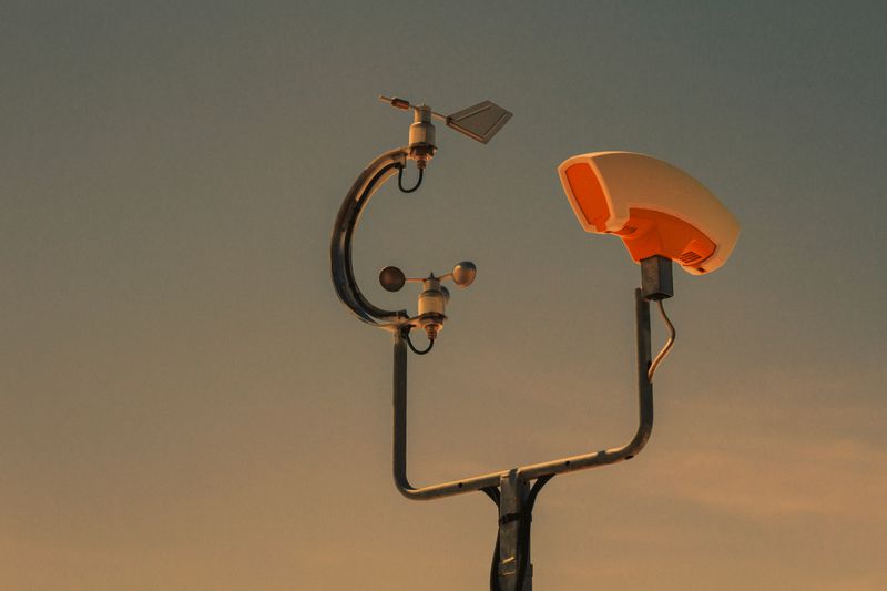 Weather monitoring equipment with sunset sky